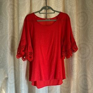 Woman’s blouse, coral color, size large